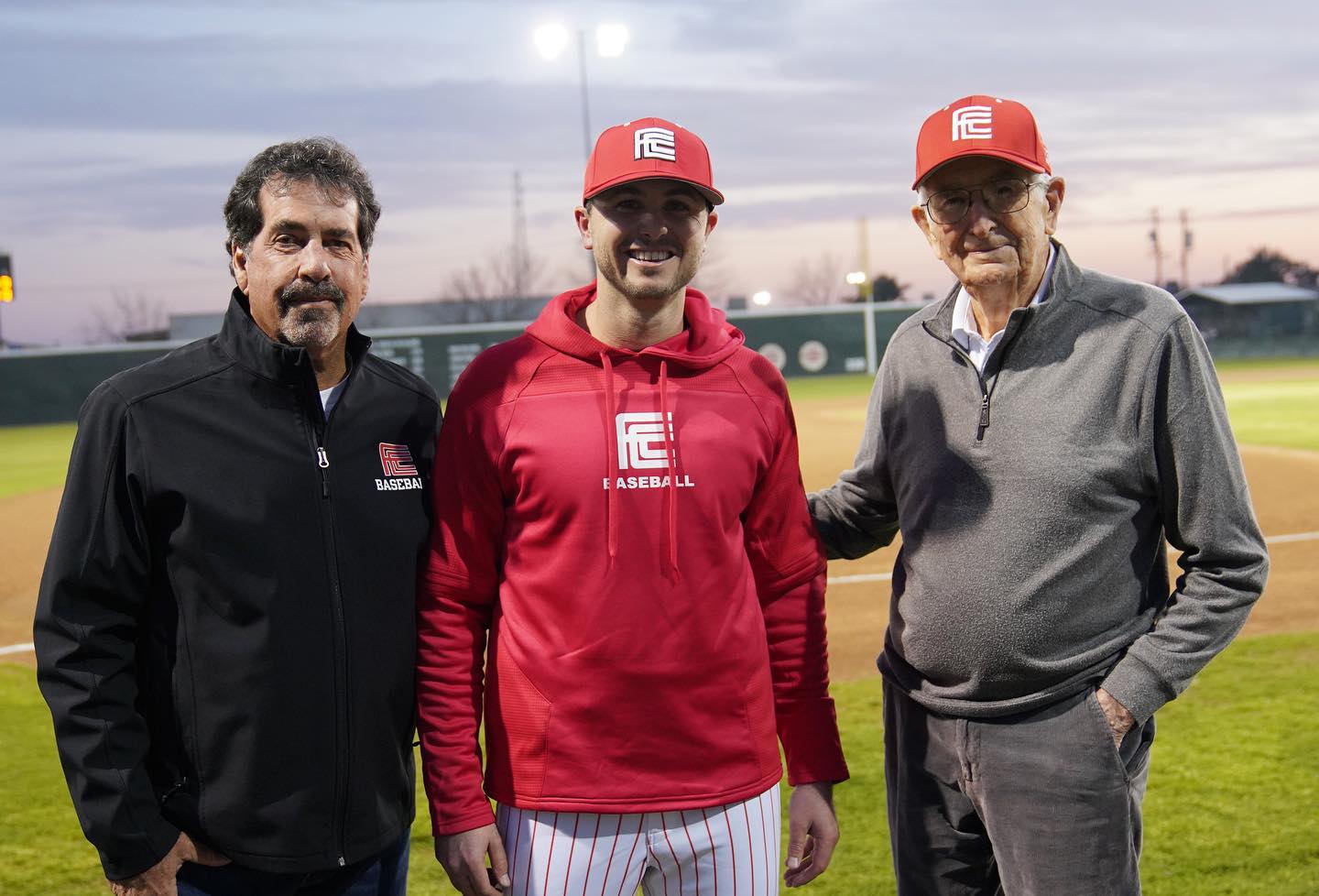 Former Fresno City coaches Ron Scott and Len Bourdet with new head coach Mitch Karraker (center).